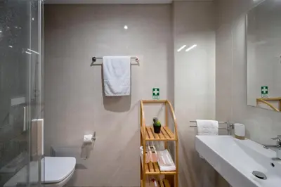 a bathroom with a sink and a toilet and a shower at Pena II by An Island Apart in Funchal