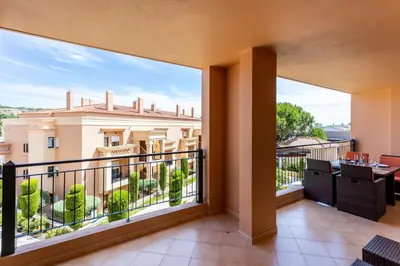 a balcony with a view of a building at Rock and Sea - Baia da Luz in Luz
