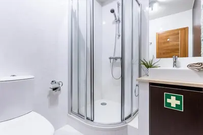 a bathroom with a shower and a toilet and a sink at Rock and Sea - Baia da Luz in Luz