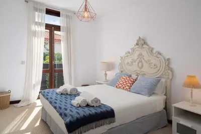 a bedroom with a bed with towels on it at Charming Villa, spacious, beautiful views! in Funchal