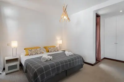 a bedroom with a bed with towels on it at Charming Villa, spacious, beautiful views! in Funchal