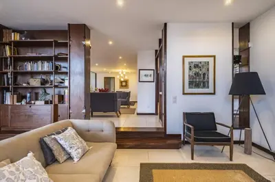 a living room with a couch and a chair at Charming Villa, spacious, beautiful views! in Funchal