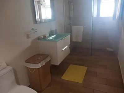 a bathroom with a toilet and a sink and a shower at CASA SOL E VISTA 2 in Arco da Calheta