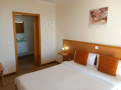 a hotel room with a bed and a bathroom at CASA SOL E VISTA 2 in Arco da Calheta