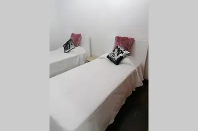two beds in a room with two pillows on them at Vila Relax Vacation Rental, Funchal in Funchal