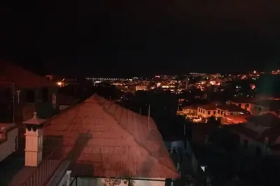 a view of a city at night with lights at Vila Relax Vacation Rental, Funchal in Funchal