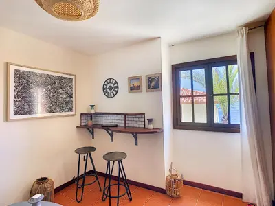 a room with two stools and a window at Pôr do Sol by LovelyStay in Calheta