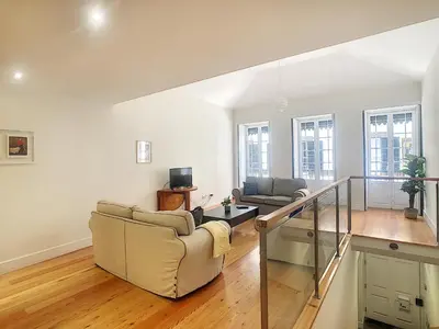 a living room with two couches and a table at Casa Conceição by LovelyStay in Funchal