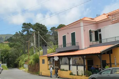 people standing outside of a building on a street at OurMadeira - SeaView Apartment in Calheta