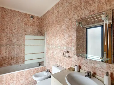 a bathroom with a sink and a toilet and a mirror at Gemini Apartment by LovelyStay in Funchal