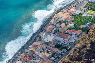 an aerial view of a village next to the ocean at Zoe House in Paul do Mar