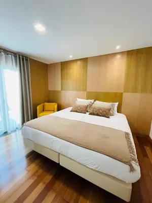 a bedroom with a large bed in a room at Villas Calhau da Lapa 51 in Campanário