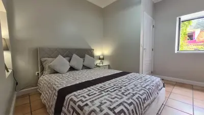 a bedroom with a large bed in a room at Casa da Avó Duca in Machico