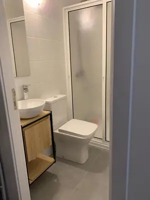 a bathroom with a toilet and a sink and a shower at Shining in Funchal