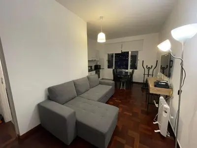 a living room with a couch and a table at Shining in Funchal