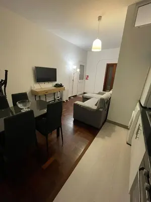 a living room with a couch and a table at Shining in Funchal