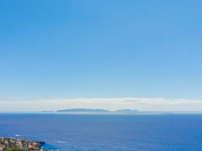 a view of the ocean with islands in the distance at Flowers island house 3 in Caniço