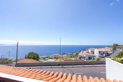 a view of the ocean from the roof of a house at Flowers island house 3 in Caniço