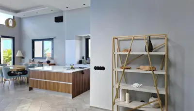 a living room with a counter and a kitchen at Villa Estrelícia by LovelyStay in Ribeira Brava