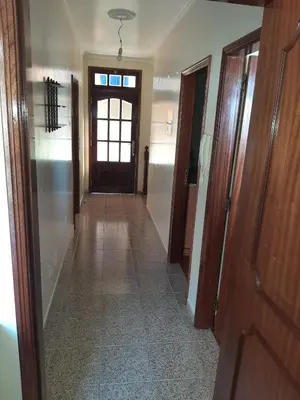 an empty hallway with a door and a hallwayngth at Casa do Terço in Câmara de Lobos