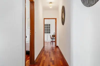 a hallway with a mirror and a table in a room at Sea View Villa by Homie in Santa Cruz