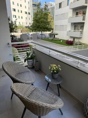 two chairs and a table on a balcony at Residência Costa do Sol in Funchal