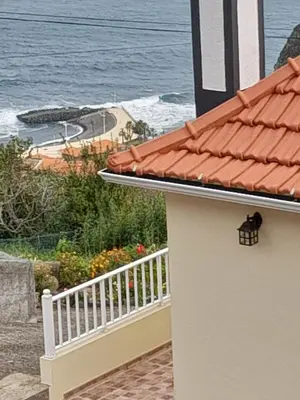 a building with a view of the ocean at Panoramic Ocean View House in Faial