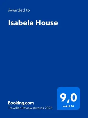 a bedroom with a large bed with two pillows at Isabela House in Ponta do Sol