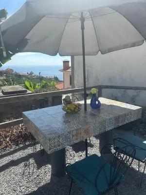 a view of the ocean from a building at Isabela House in Ponta do Sol