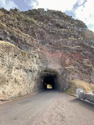 a tunnel in the side of a mountain at The Palms Apartment - Sun & Sea Madeira in Madalena do Mar