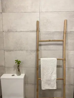 a towel rack next to a toilet in a bathroom at The Palms Apartment - Sun & Sea Madeira in Madalena do Mar