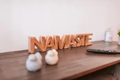 a wooden sign that reads names next to a remote control at The Millennial Lifestyle Apartment by Amazing Madeira in Funchal