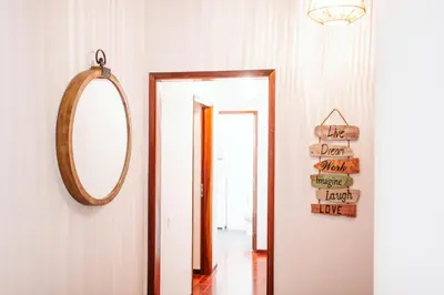 a mirror hanging on a wall next to a hallway at The Millennial Lifestyle Apartment by Amazing Madeira in Funchal