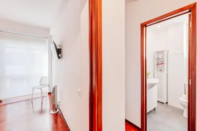 a bathroom with a mirror and a toilet at The Millennial Lifestyle Apartment by Amazing Madeira in Funchal