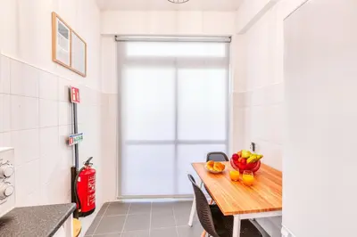 a kitchen with a table with fruit on it at The Millennial Lifestyle Apartment by Amazing Madeira in Funchal