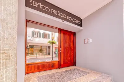 a red door in front of a store at The Millennial Lifestyle Apartment by Amazing Madeira in Funchal