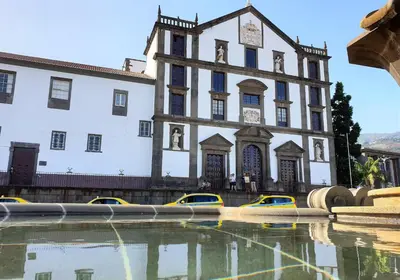 a building with a pool of water in front of it at Le Vingale in Funchal