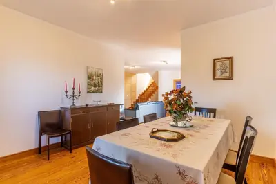 a dining room with a table and chairs at Villa Dinis by Holiday Rental Madeira in Calheta