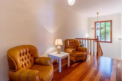 two chairs and a table in a living room at Villa Dinis by Holiday Rental Madeira in Calheta