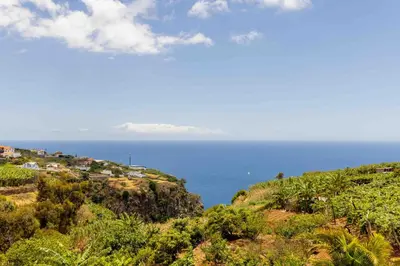 a view of the ocean from a hill at House - sleeps 3 free parking garden & jacuzzi in Estreito da Calheta