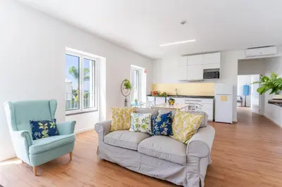 a living room with a couch and a chair at Casa Amarela Apartments - by Casas na Ilha in Câmara de Lobos