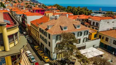 an aerial view of a city with buildings at FLH Viola Market Studios in Funchal