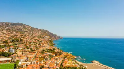 an aerial view of a town next to the ocean at FLH Viola Market Studios in Funchal