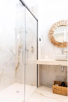 a bathroom with a shower and a sink at Rooftop Funchal I by Madeira Best Apartments in Funchal