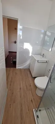 a bathroom with a toilet and a sink at Chalé Funchal - City view in Funchal