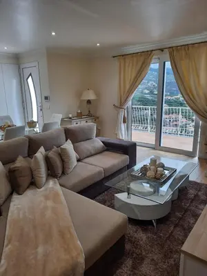 a living room with a couch and a table at Casa Del Mar in Ponta do Sol