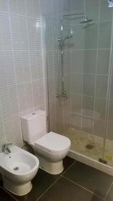 a bathroom with a toilet and a shower and a sink at Casa Vista Mar in Luz