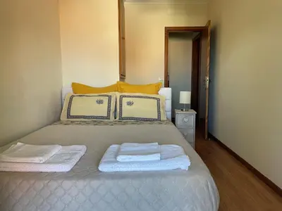 a bedroom with a bed with two towels on it at Cosy 2 bedroom home in the heart of Jardim do Mar in Jardim do Mar