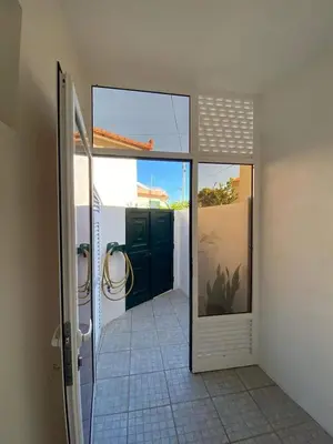a bathroom with a shower and a glass door at Cosy 2 bedroom home in the heart of Jardim do Mar in Jardim do Mar