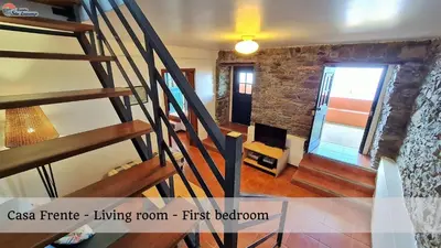 a staircase leading to a living room first bedroom at Quinta São Lourenço in Fajã da Ovelha